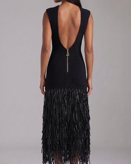 Rear view of black sleeveless midi dress showing open back and fringe hem details