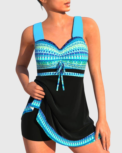 Women's patterned tankini swimsuit with blue geometric print top and black skirt bottom