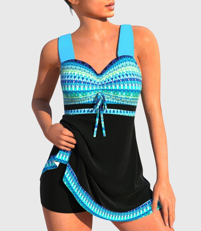 Women's patterned tankini swimsuit with blue geometric print top and black skirt bottom