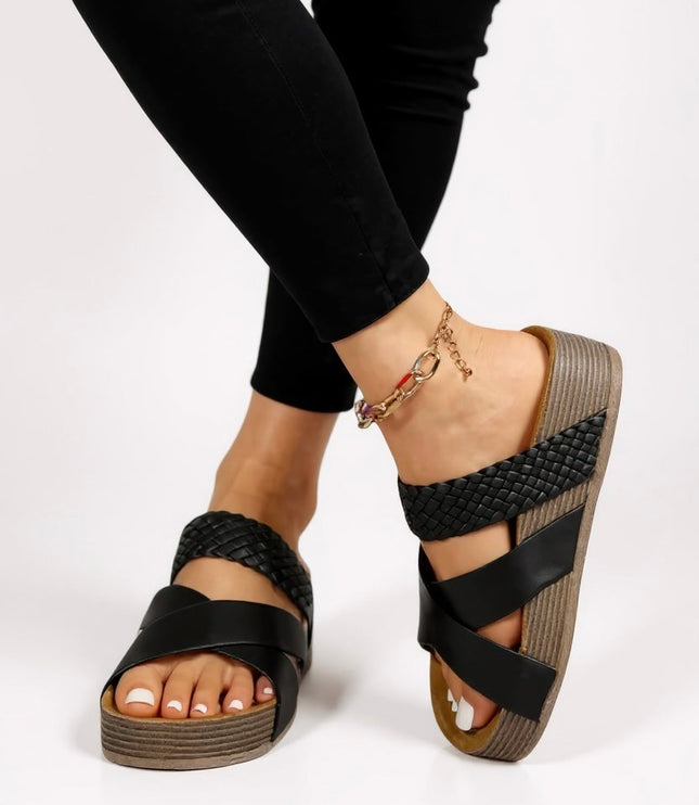 Black braided and strappy platform sandals with textured sole