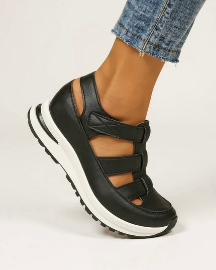 Black platform sandals with multiple adjustable straps, side profile view