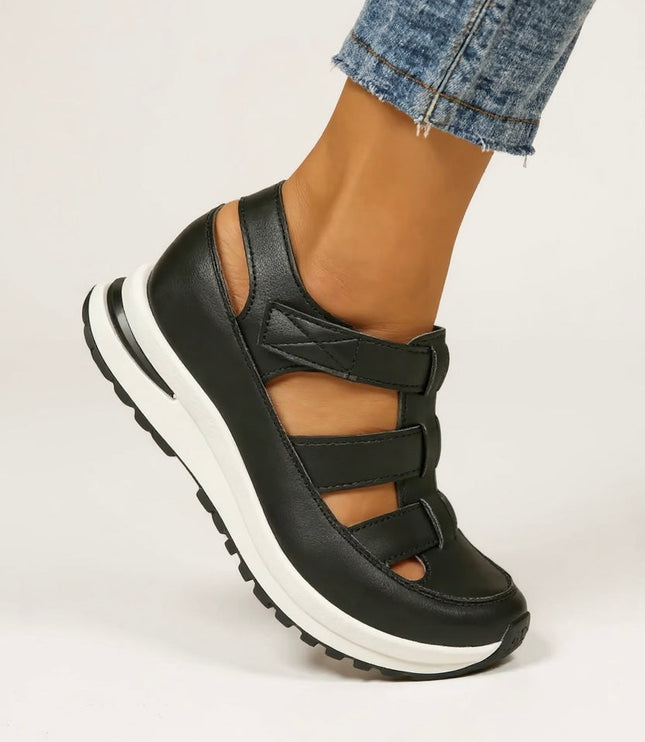 Black platform sandals with multiple adjustable straps, side profile view