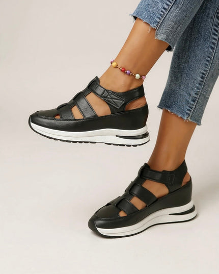 White platform sandals with adjustable straps and black white sole detail