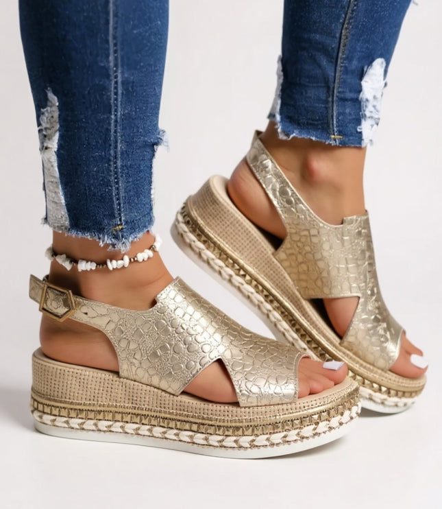 Pair of metallic gold croc peep toe platform sandals with chunky textured sole