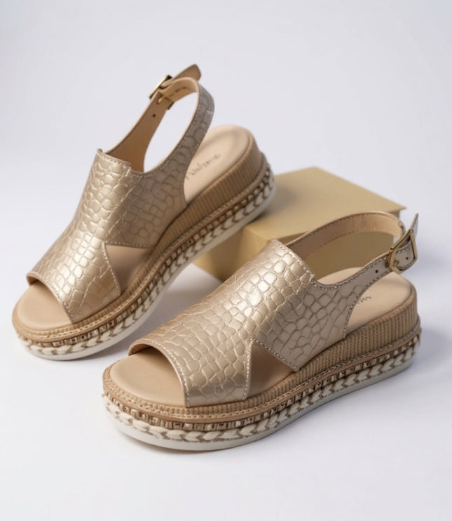 Two metallic gold croc platform sandals displayed, showing peep toe and ankle buckle