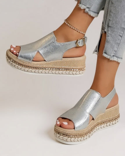 Silver metallic croc peep toe platform sandals worn with light jeans, full foot view
