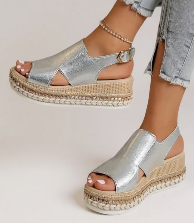 Silver metallic croc peep toe platform sandals worn with light jeans, full foot view