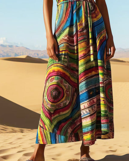 Mid-section view of the women's rainbow print maxi sundress, highlighting the detailed patterns and colors of the flowing skirt.