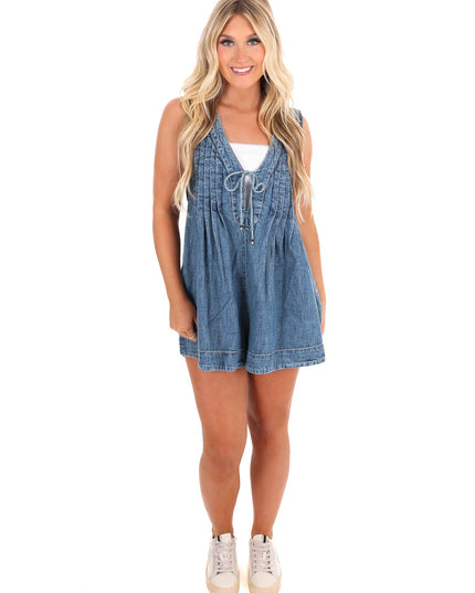 Denim mini romper with deep v-neckline and front tie closure detail