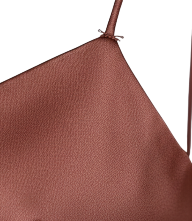 Back view of rust satin slip dress with crisscross spaghetti straps and open back