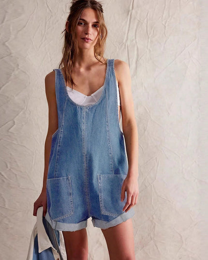 Front full-length view of light blue denim romper with scoop neckline