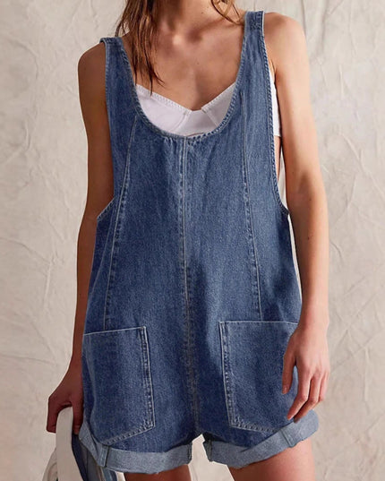 Front close-up of denim romper showing scoop neck, pockets, and rolled cuffs