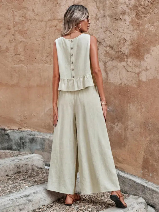 Back view of cream ruffle top with button detail and wide leg lounge pants