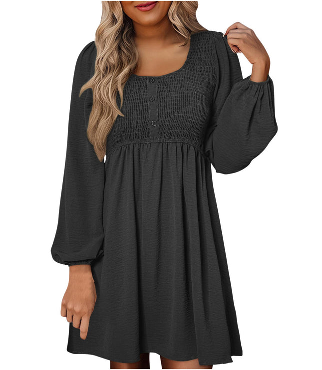 Black smocked empire waist mini dress with long balloon sleeves