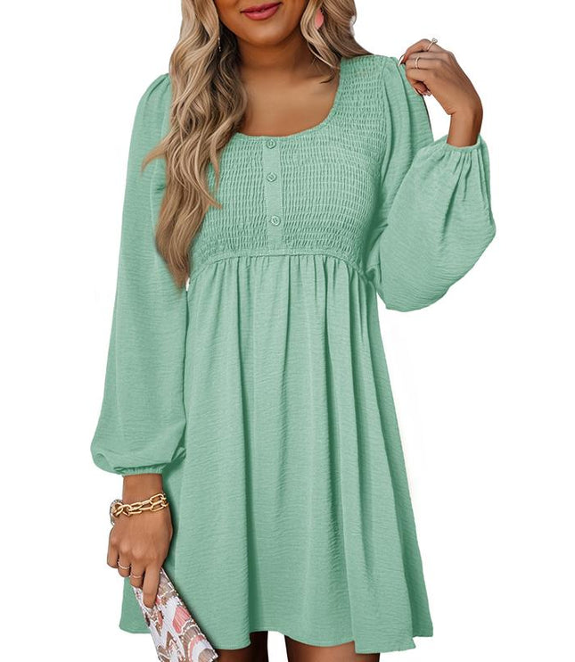 Mint green smocked empire waist mini dress with long puffed sleeves