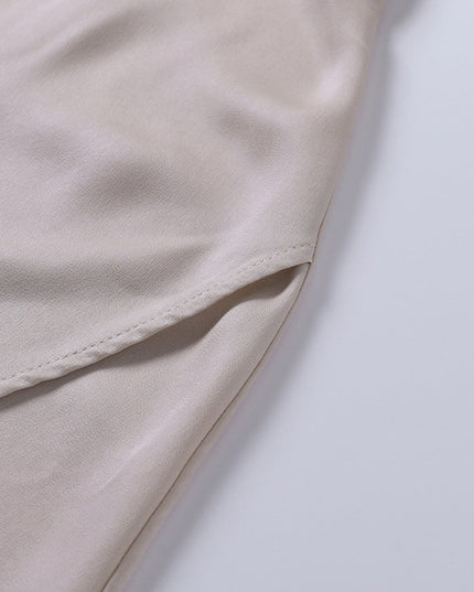 Cream draped maxi dress side slit detail with soft fabric folds