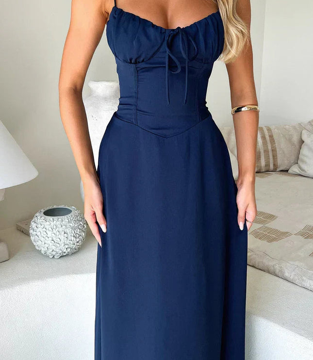 Navy maxi dress with sweetheart neckline, tie bow, and fitted bodice detail