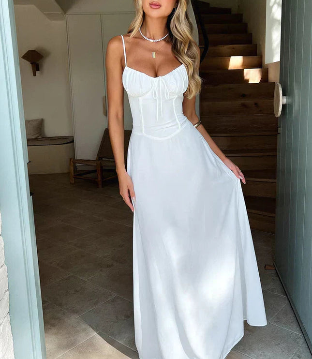 White sweetheart tie bow spaghetti strap maxi dress with flowing silhouette
