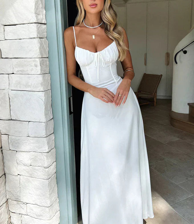 White maxi dress with sweetheart neckline, tie bow detail, and spaghetti straps