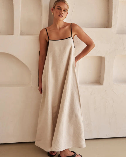 Cream linen maxi dress with thin black straps and relaxed A-line fit