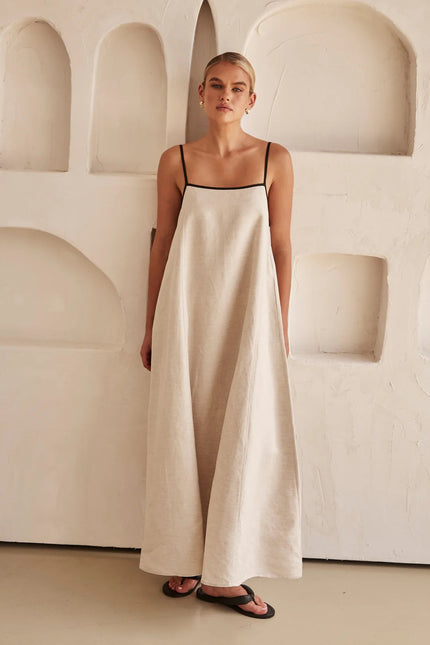 Cream linen spaghetti strap maxi dress with floor-length hem and black trim