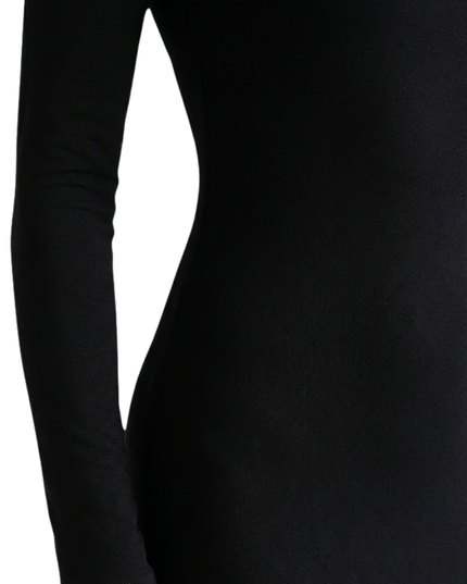 Close-up of black long sleeve maxi dress showing square neckline and smooth stretch fabric