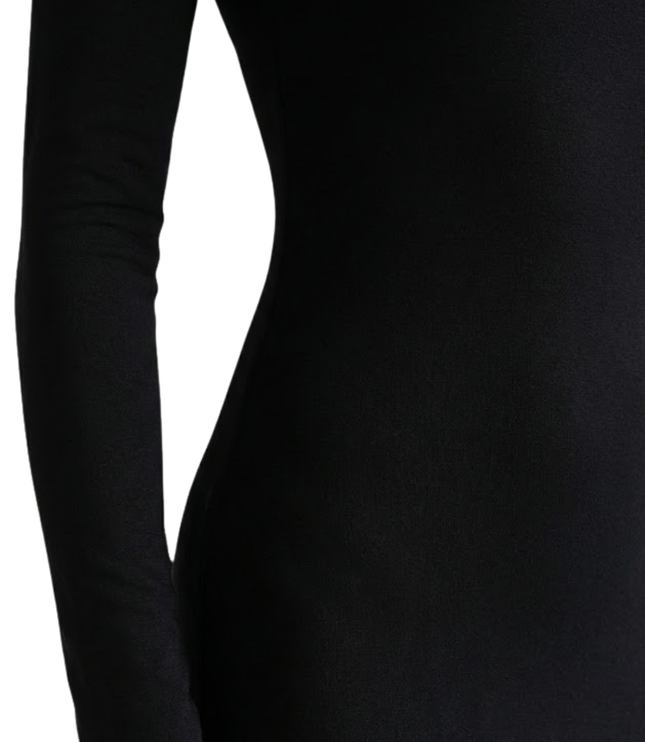 Close-up of black long sleeve maxi dress showing square neckline and smooth stretch fabric