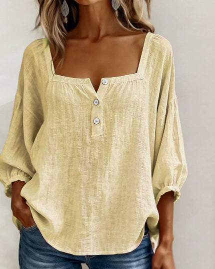 Cream linen button top with square neckline and puffed three-quarter sleeves