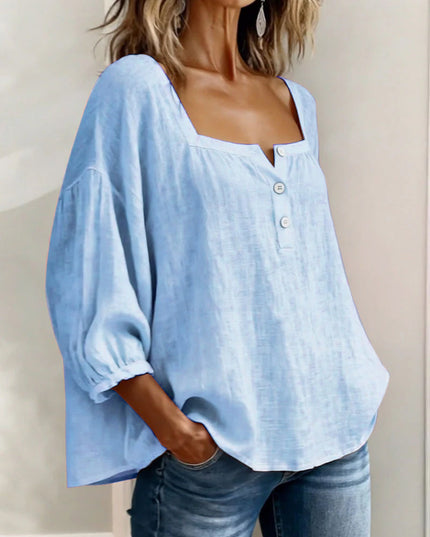 Light blue linen square neck puff sleeve top with button closure and soft drape