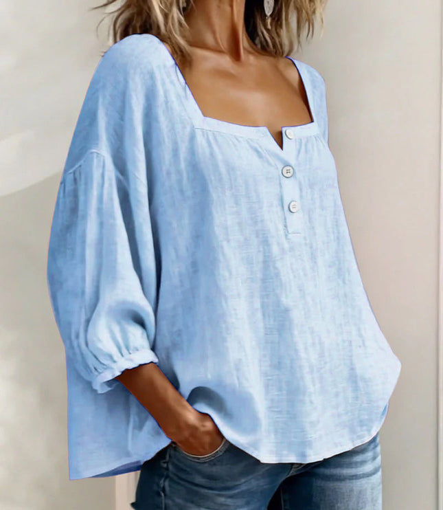 Light blue linen square neck puff sleeve top with button closure and soft drape
