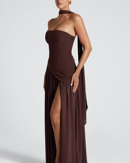 Side profile of burgundy strapless maxi dress with pleated skirt