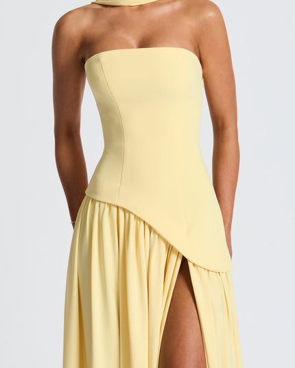Strapless yellow maxi dress with asymmetrical draped skirt and slit