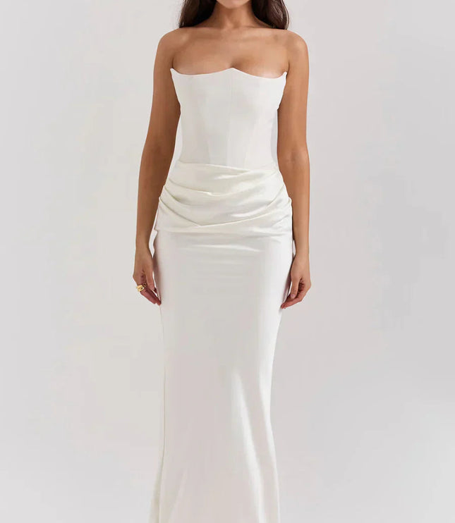 Front view of a white strapless sweetheart corset maxi dress, featuring a draped waist and flowing skirt.