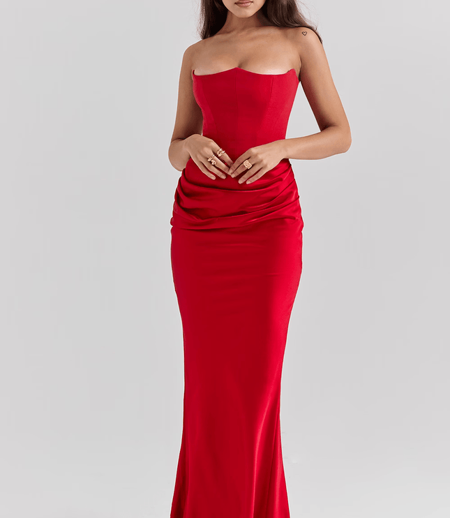 Front view of a women's red strapless sweetheart corset maxi dress, showcasing the structured bodice and flowing skirt.