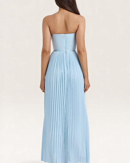 Rear view light blue strapless pleated maxi dress with fitted waist