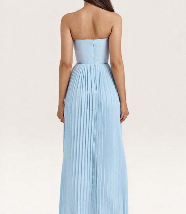 Rear view light blue strapless pleated maxi dress with fitted waist