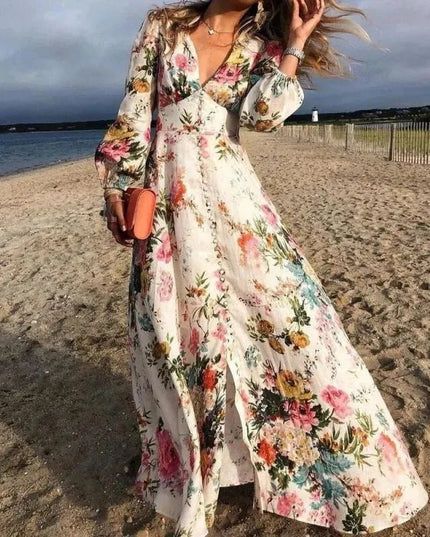 Women's floral V-neck maxi dress with long sleeves and flowing beach style skirt