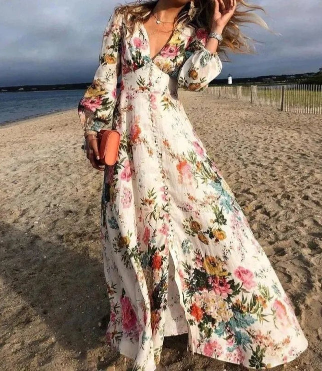 Women's floral V-neck maxi dress with long sleeves and flowing beach style skirt