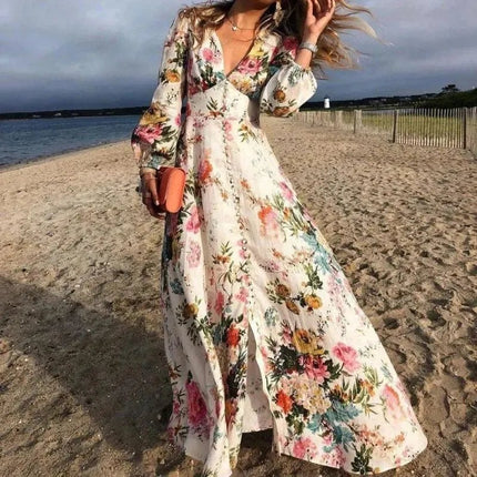 Women's floral V-neck maxi dress with long sleeves and flowing beach style skirt