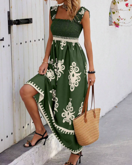 Green floral bohemian maxi dress with cream print, smocked waist and sleeveless cut
