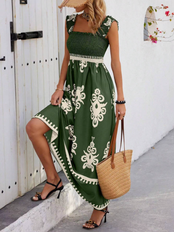 Green floral bohemian maxi dress with cream print, smocked waist and sleeveless cut