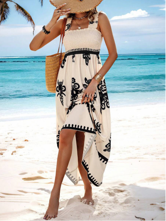 Cream beach maxi dress with black floral print, high-low hem and smocked bodice