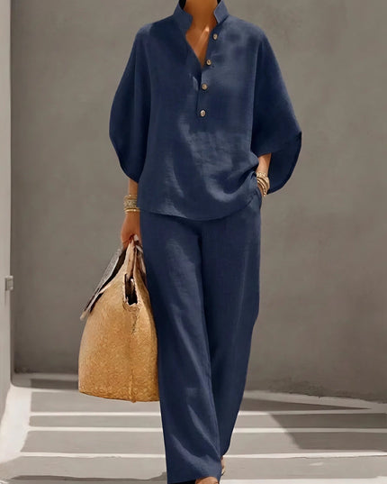 Navy blue two piece set with stand collar button up top and wide leg pants