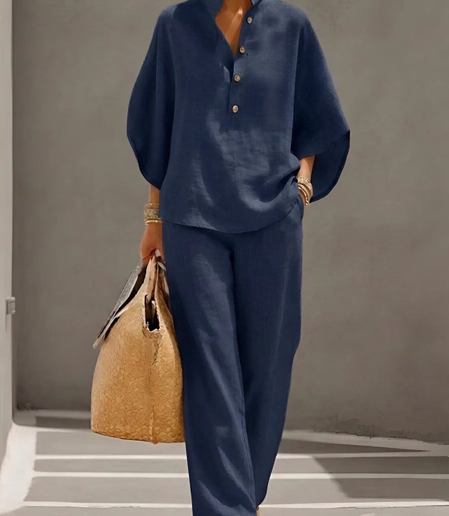 Navy blue two piece set with stand collar button up top and wide leg pants