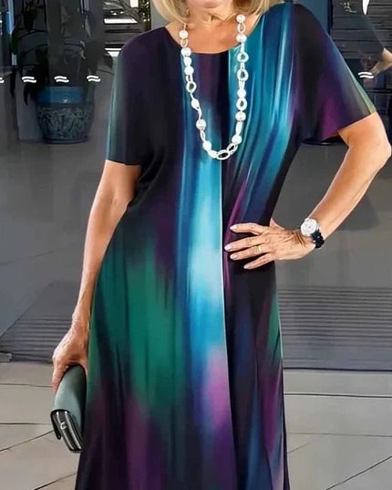 Dark midi dress with teal, purple and green vertical abstract print, casual women’s t shirt dress