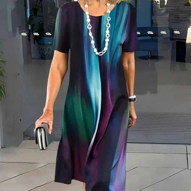 Front view of dark abstract print midi dress with blue and purple streaks, short sleeve women’s dress