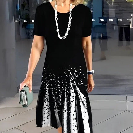 Black midi dress with white abstract splatter print and short sleeves, casual women’s t shirt dress