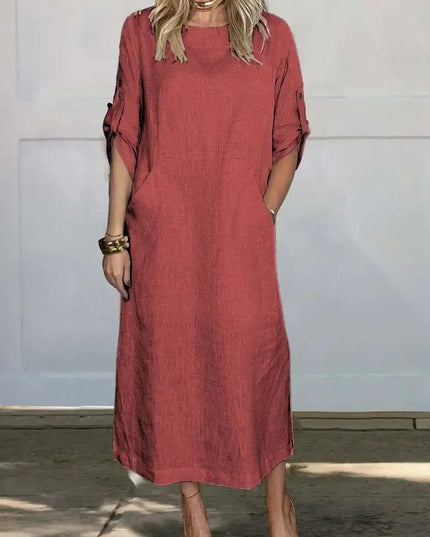 Coral summer midi dress with pockets, rolled sleeves, and easy pull-on shape