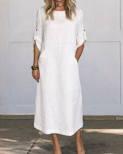 White summer midi dress with pockets, rolled sleeves, and relaxed straight fit