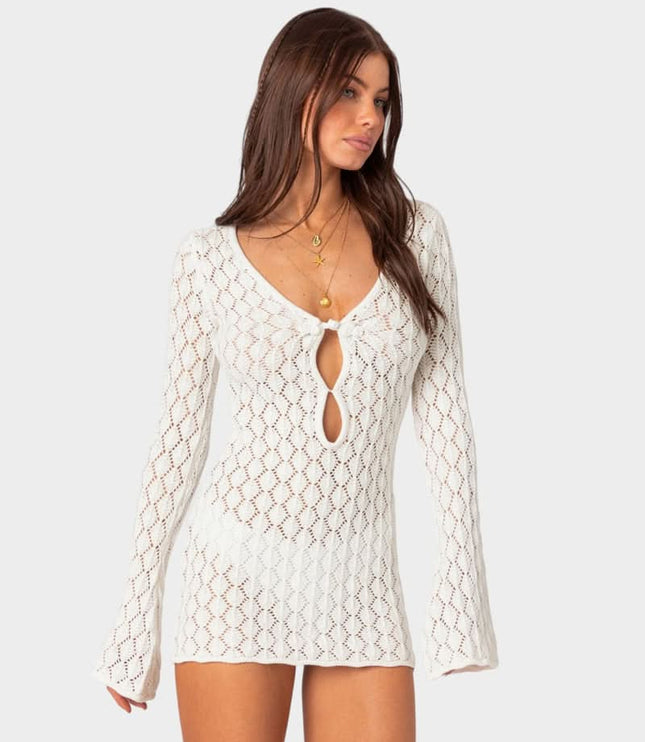 Front view of white summer crochet mini dress with tie front and flared sleeve cuffs